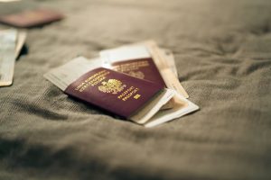 Australian immigration security: Polish passport & travel docs on fabric, symbolizing identity.