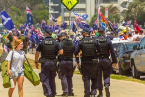 Police officers oversee a vibrant Australia Day march in Surfers Paradise, Australia.