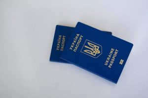 Australian permanent residency for Koreans: Ukrainian passports symbolize travel & ID.