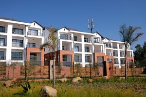 Sydney $1M home guide: contemporary apartment complex, white facade, red brick, Australia