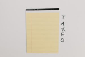 Australian taxes on energy profits: yellow legal pad, TAXES.